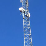 Michael installing new radios on tower.